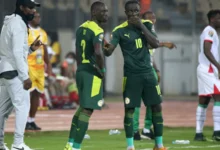 Des joueurs sénégalais échangent des consignes pendant une rencontre